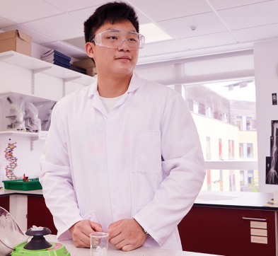 Abbey College Cambridge Male Student Working In Science Lab