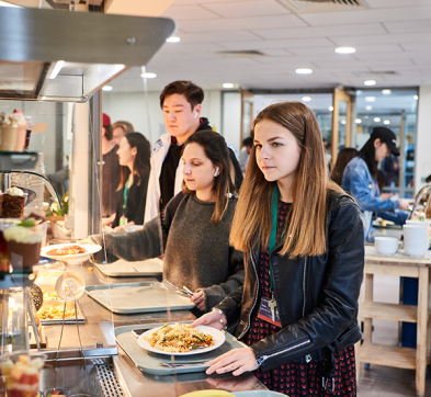 Abbey College Cambridge Female Student In Dining Room