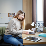 Female Student Revising In Their Bedroom At Abbey College Cambridge