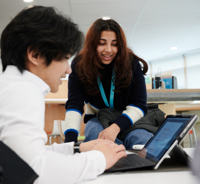 Students Working Together In The College Library