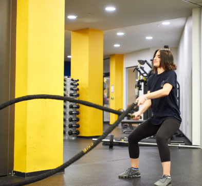 Female Student Excercising In Our College Gym